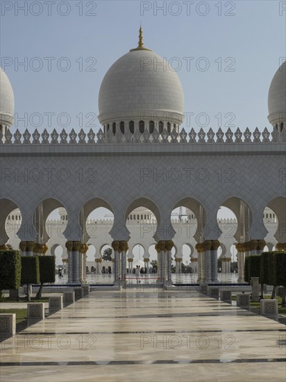 Large mosque arcades and domes, supported by impressive arches in daylight, beautiful mosque with