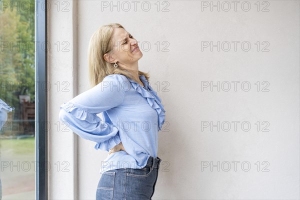 Mid-adult woman with waist pain