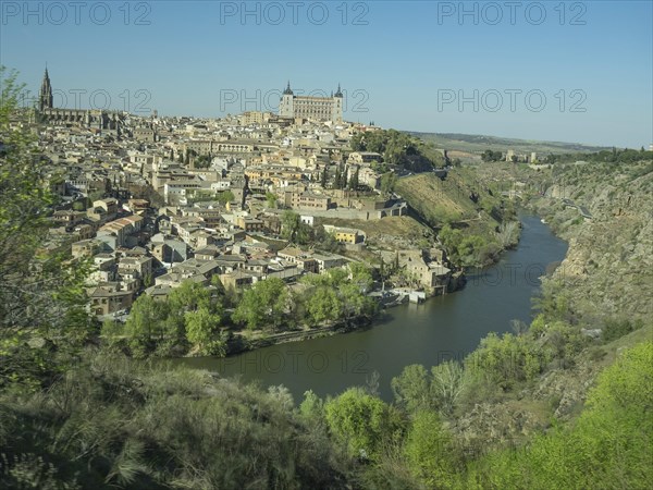 Historic city on the river with impressive architecture and striking church towers, situated on a