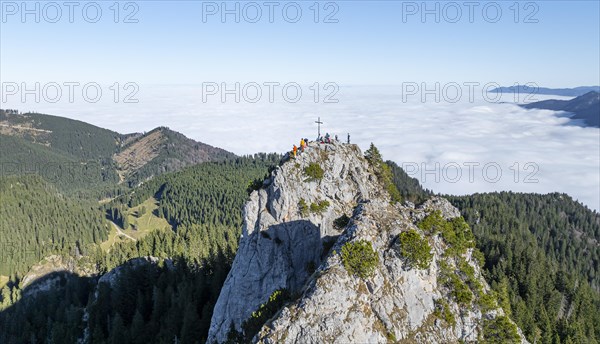 Aerial view, rocky summit of the Ettaler Manndl, view over mountain landscape and sea of clouds,