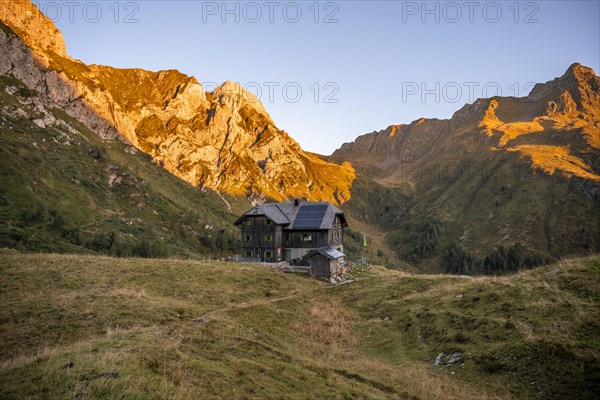 Alpine club hut, Hochweisssteinhaus mountain hut, mountain landscape with green mountain meadows