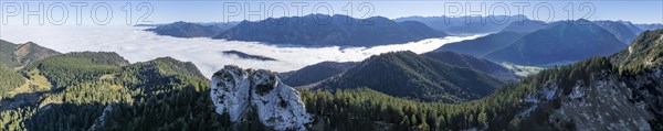 Aerial view, rocky summit of the Ettaler Manndl, view over mountain landscape and sea of clouds,