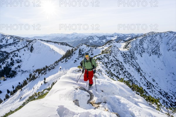 Mountaineer on the ridge of the Aiplspitz in the snow, snow-covered mountain landscape with