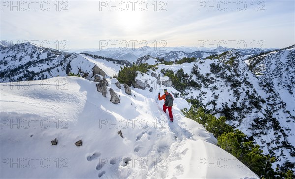 Mountaineer on the ridge of the Aiplspitz in the snow, snow-covered mountain landscape with