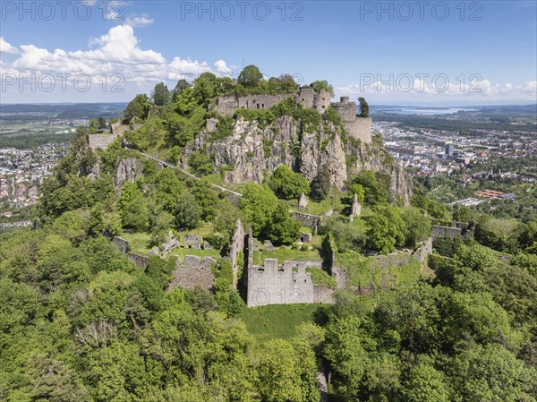 Aerial view of the Hohentwiel volcanic cone with Germany's largest fortress ruins, behind it the