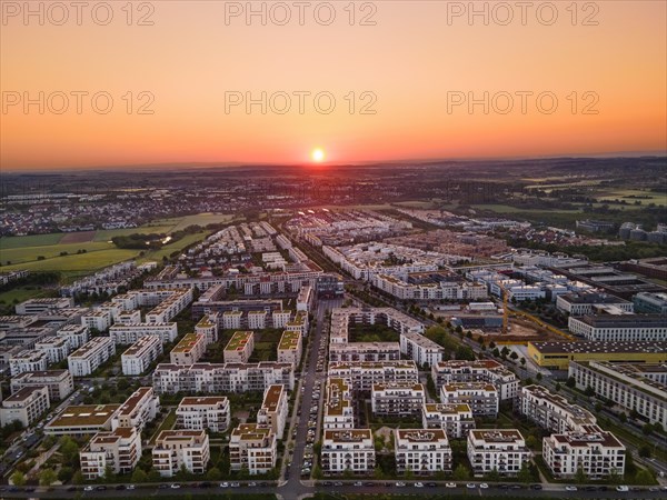 The sun rises over the Riedberg district of Frankfurt. (Aerial view with a drone), Riedberg,