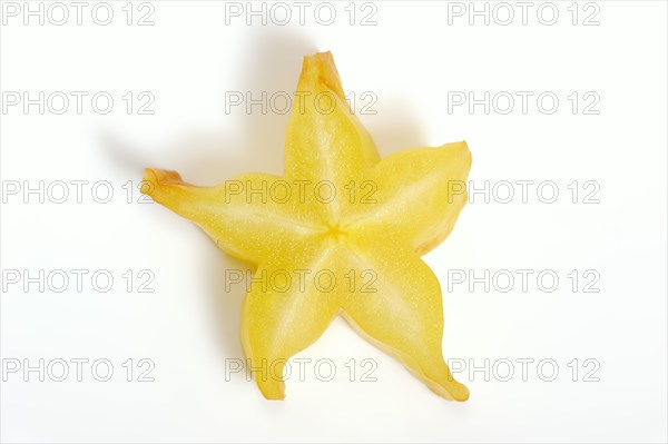 Star fruit or carambola (Averrhoa carambola), sliced fruit on a white background