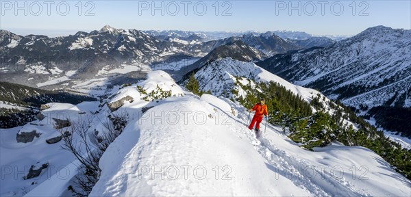 Mountaineer on the summit of the Aiplspitz in the snow, snow-covered mountain landscape with