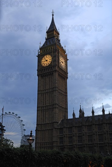 Big Ben, Bridge Street, in the dusk at the back left the Ferris wheel on the Thames, London,