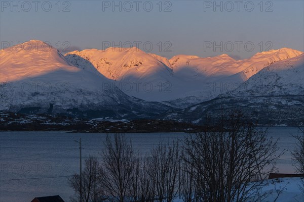 Sunset in the Lyngenfjord with a view of Sorbmegaisa, Norway, Europe