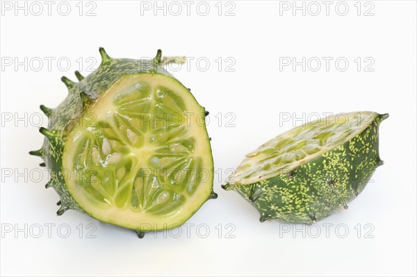 African horned melon (Cucumis metuliferus), sliced fruit on a white background