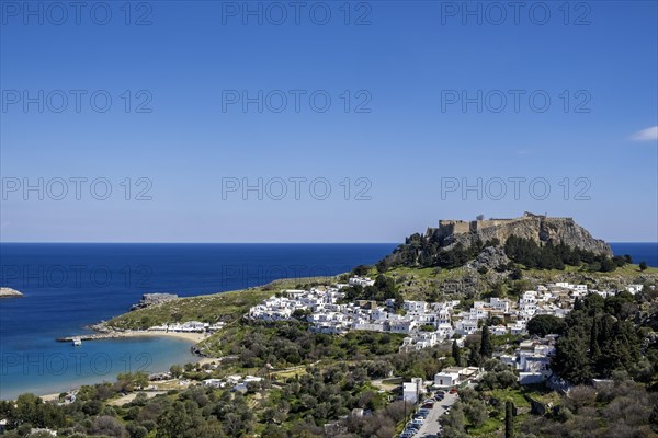 View of the Acropolis and the white houses of Lindos, Rhodes, Dodecanese archipelago, Greek