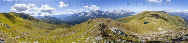 Panorama, hiking trail between green mountain meadows on a mountain ridge, mountain panorama, view