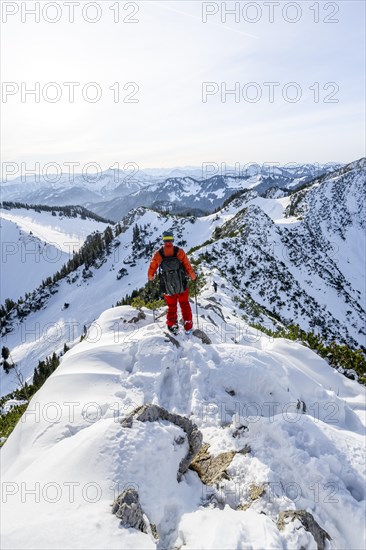 Mountaineer on the ridge of the Aiplspitz in the snow, snow-covered mountain landscape with