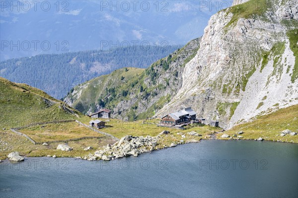 Obstanserseehuette mountain hut on the Obstansersee mountain lake, Carnic main ridge, Carnic High