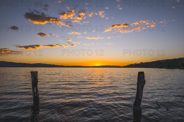 Sunset over Lake Sempach with glowing clouds, Sempach, Lucerne, Switzerland, Europe