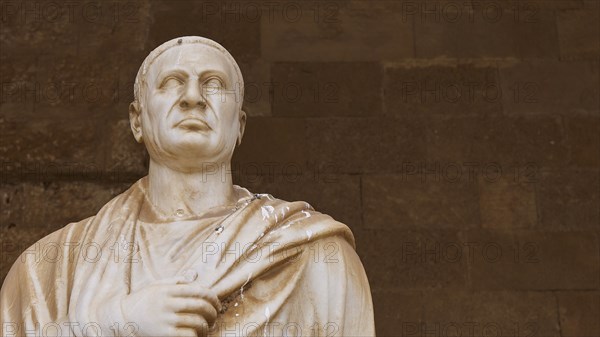 Ancient marble sculpture of a man in toga with fine drapery, statue from the 1st century BC,