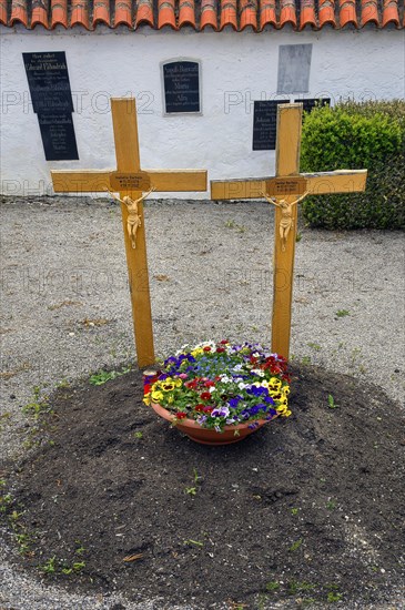 Simple grave with two crosses near the cemetery church of St Stephan, Irsee, Swabia, Bavaria,