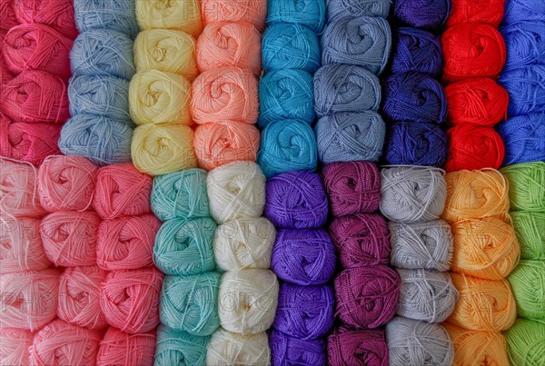 Close-up of a group of balls of colored wool with a pattern