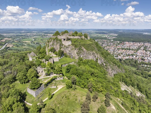 Aerial view of the Hohentwiel volcanic cone with Germany's largest fortress ruins, behind it the