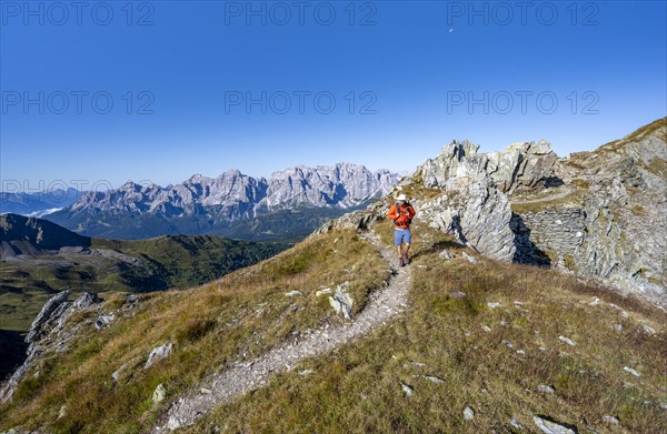 Mountaineers on a hiking trail, old war positions from the First World War, mountain panorama, view