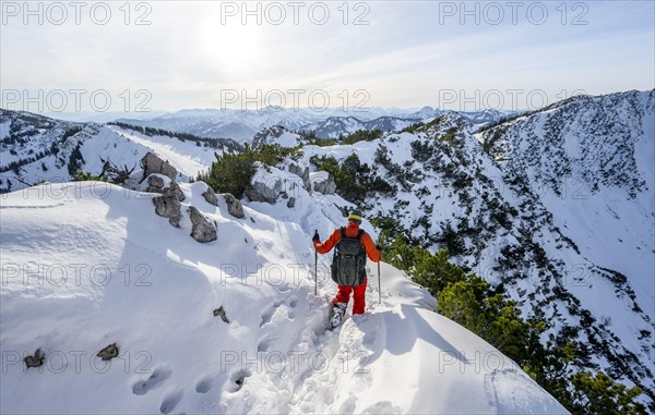 Mountaineer on the ridge of the Aiplspitz in the snow, snow-covered mountain landscape with