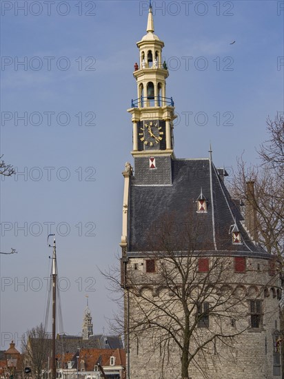 Historic clock tower with a view of the city and sailing boats against a blue sky, tower with a