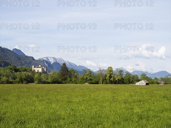 Evening light, meadow with hay barn, Trautenfels Castle, near Irdning, Enns Valley, Styria