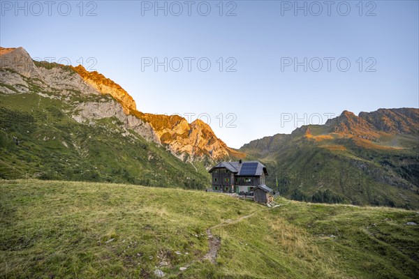 Alpine club hut, Hochweisssteinhaus mountain hut, mountain landscape with green mountain meadows