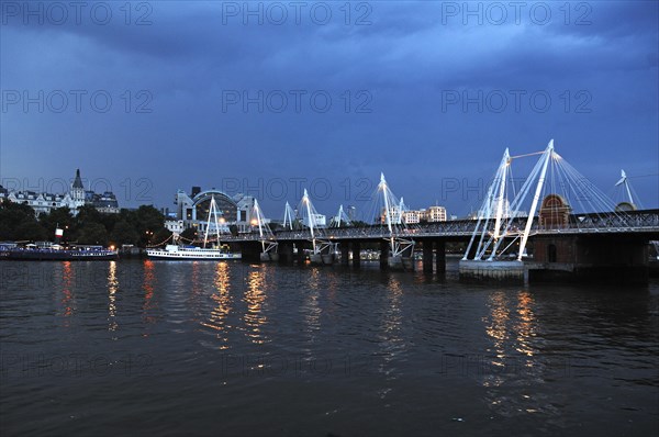 Hungerford Bridge over the Thames at dusk, London, England, Great Britain