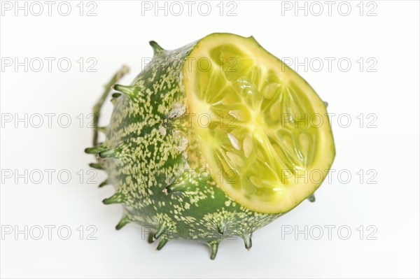 African horned melon (Cucumis metuliferus), sliced fruit on a white background