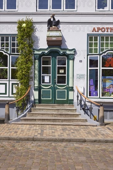 Entrance to the Adler Pharmacy, Royal Privileged Pharmacy in Friedrichstadt, District of North
