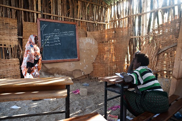 Muslim female teacher teaching mathematics, school in a remote village inhabited by the Afar