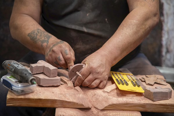 Pipestone, Minnesota, A Native American makes pipes from pipestone at Pipestone National Monument.