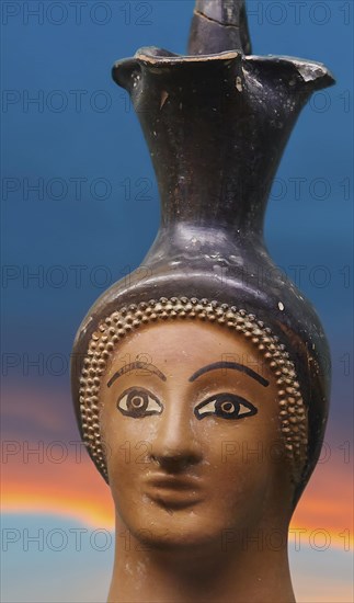 Oinochoe, ancient Greek wine jug with handle in the shape of a woman's head, motif cropped and