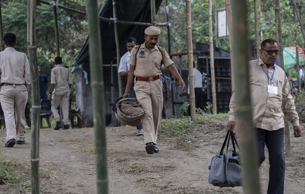 Barpeta, India. 6 May 2024. Police personnels arrives with luggage to leave for allocated polling