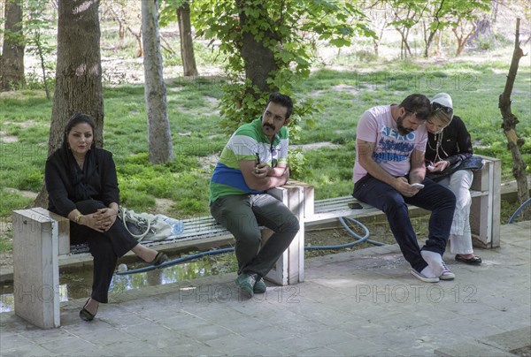 A young Iranian couple an Iranian woman and an Iranian man on 03/04/2015 sitting on a bench in the