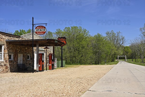 A remote stretch of historic Route 66 passes a lonely petrol station in Spencer, Missouri
