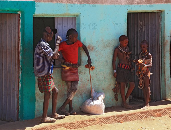 South Ethiopia, Omo region, in the village of Turmi, people standing in front of a house, the tribe