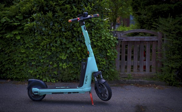 E-scooter on the side of the road in the TIER bike hire shop, Stuttgart, Baden-Wuerttemberg,