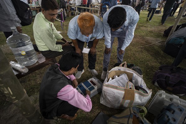 Barpeta, India. 6 May 2024. Polling officials check Electronic Voting Machines (EVMs) before