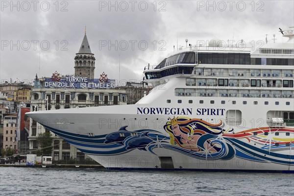 The colourfully painted cruise ship 'Norwegian Spirit' in front of the Galata Tower in Istanbul,