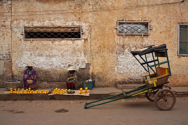 Women selling oranges, rickshaw, Ambalavao, Madagascar, Africa