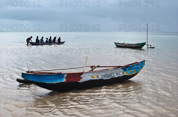 Tourists boating to visit the lagoon, Indian ocean at Foulpointe, Madagascar, Africa