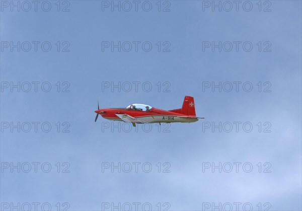 Two-seater Pilatus PC-7 turboprop training aircraft of the Swiss Air Force in flight, Payerne