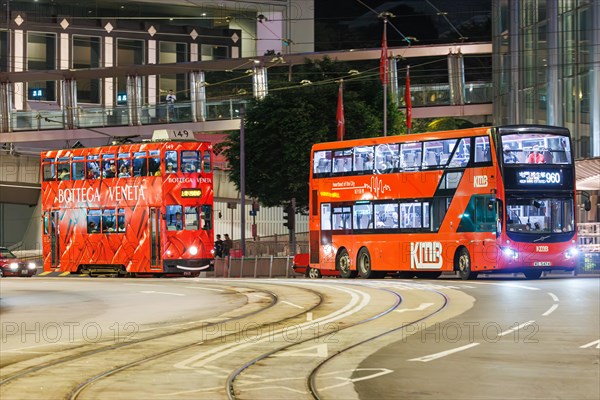 Hong Kong Tramway double-decker tram and bus public transport on Des Voeux Rd in Hong Kong, China,