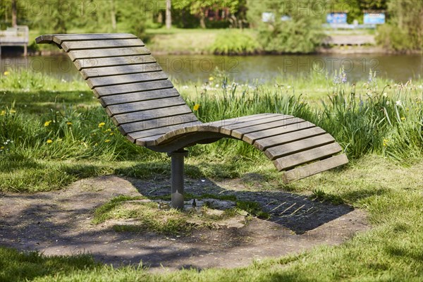 Wooden public deckchair in Friedrichstadt, Nordfriesland district, Schleswig-Holstein, Germany,