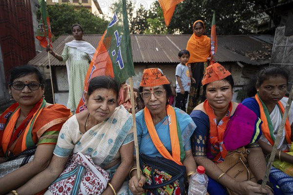 Bharatiya Janata Party (BJP) supporters waiting, to to see a roadshow of Union Home minister Amit