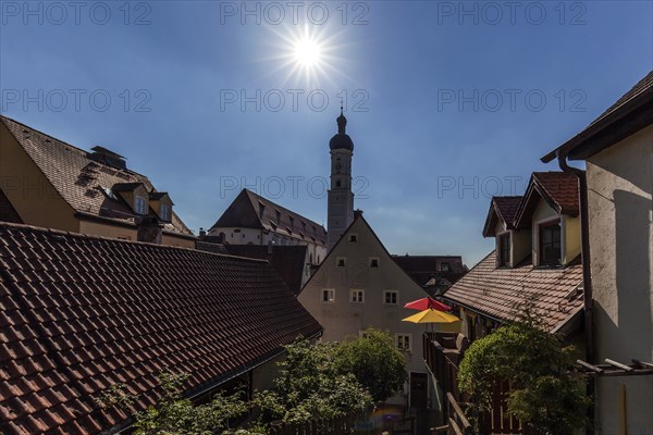 Alley in the old town of Landsberg am Lech, behind the church tower of the parish church Mariae
