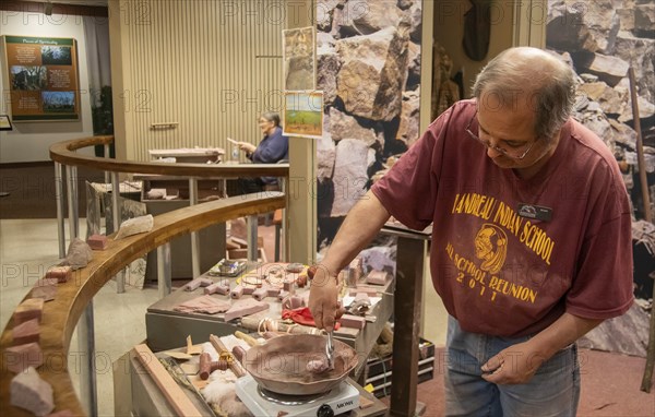 Pipestone, Minnesota, Native Americans make pipes from pipestone at Pipestone National Monument.